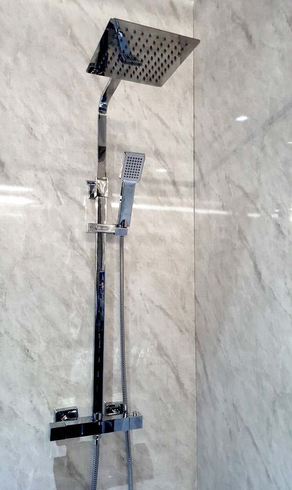 Grey Marble shower panel installed in a shower cubicle